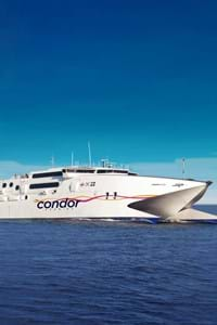 a view of condor rapide in the blue sea with a blue sky background