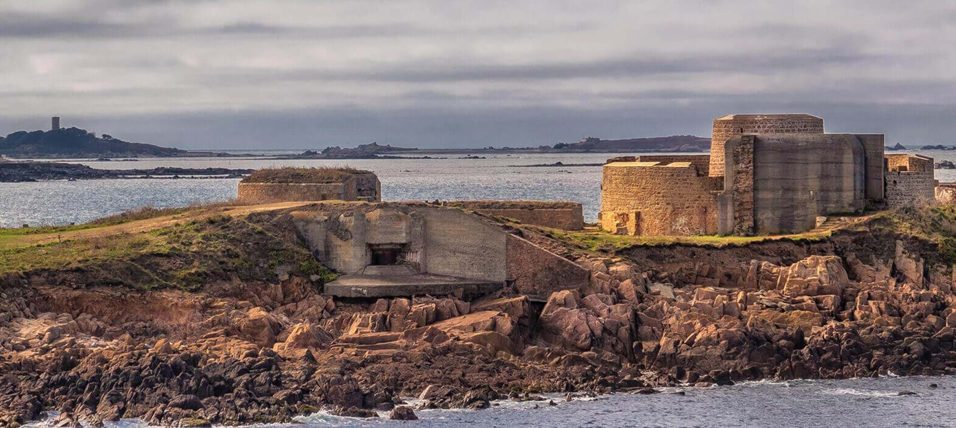 view of fort hommet in guernsey with sea in background