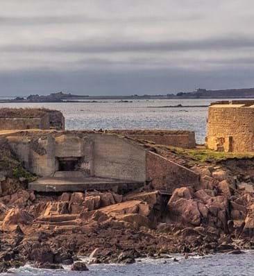 view of fort hommet in guernsey with sea in background