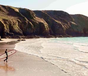 golden sand in plemont beach jersey with clear water