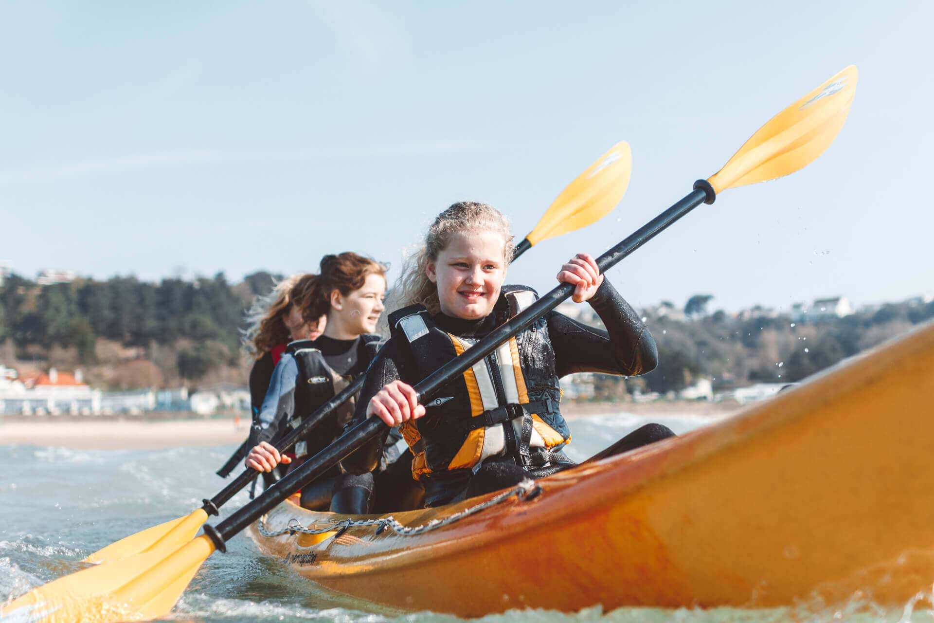friends in kayaks in the water jersey channel islands