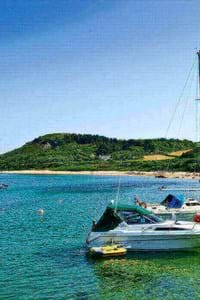 herm channel islands boat in the blue sea