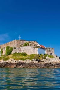 castle cornet in jersey with a background of blue sky and blue seas