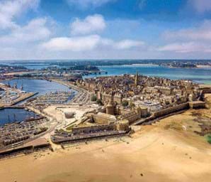 view looking over st malo brittany with blue sky and blue sea