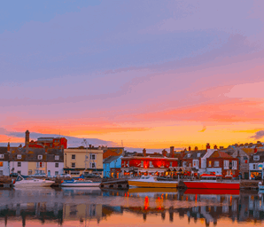 different coloured houses along port in south coast dorset uk