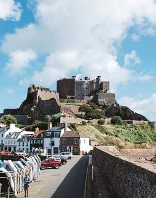 mont orgueil castle jersey blue skies ships in the sea 