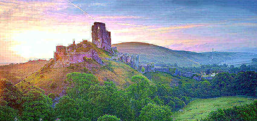the sunsets over beautiful Corfe Castle in Dorset