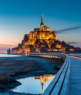 mont st michael in normandy with dark lit sky