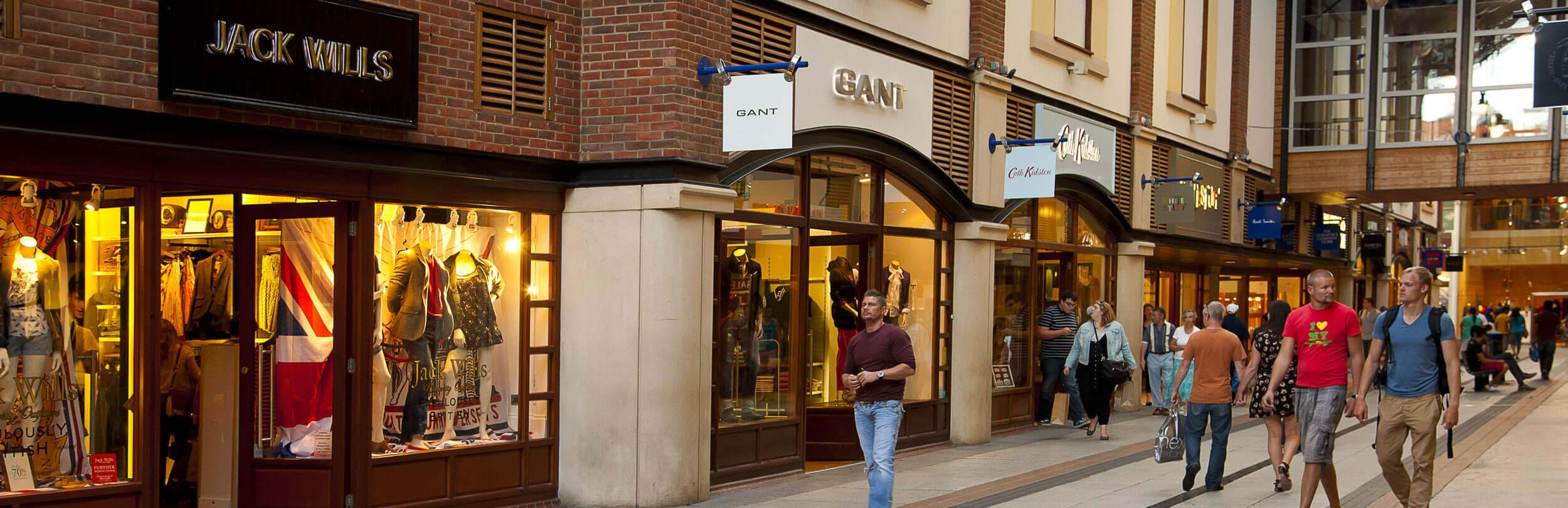 people walking past shops gunwharf quays in portsmouth
