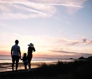 family looking over sea in jersey channel islands