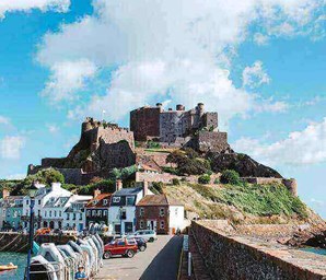 Mont Orgueil Castle Jersey with cars and boats infront