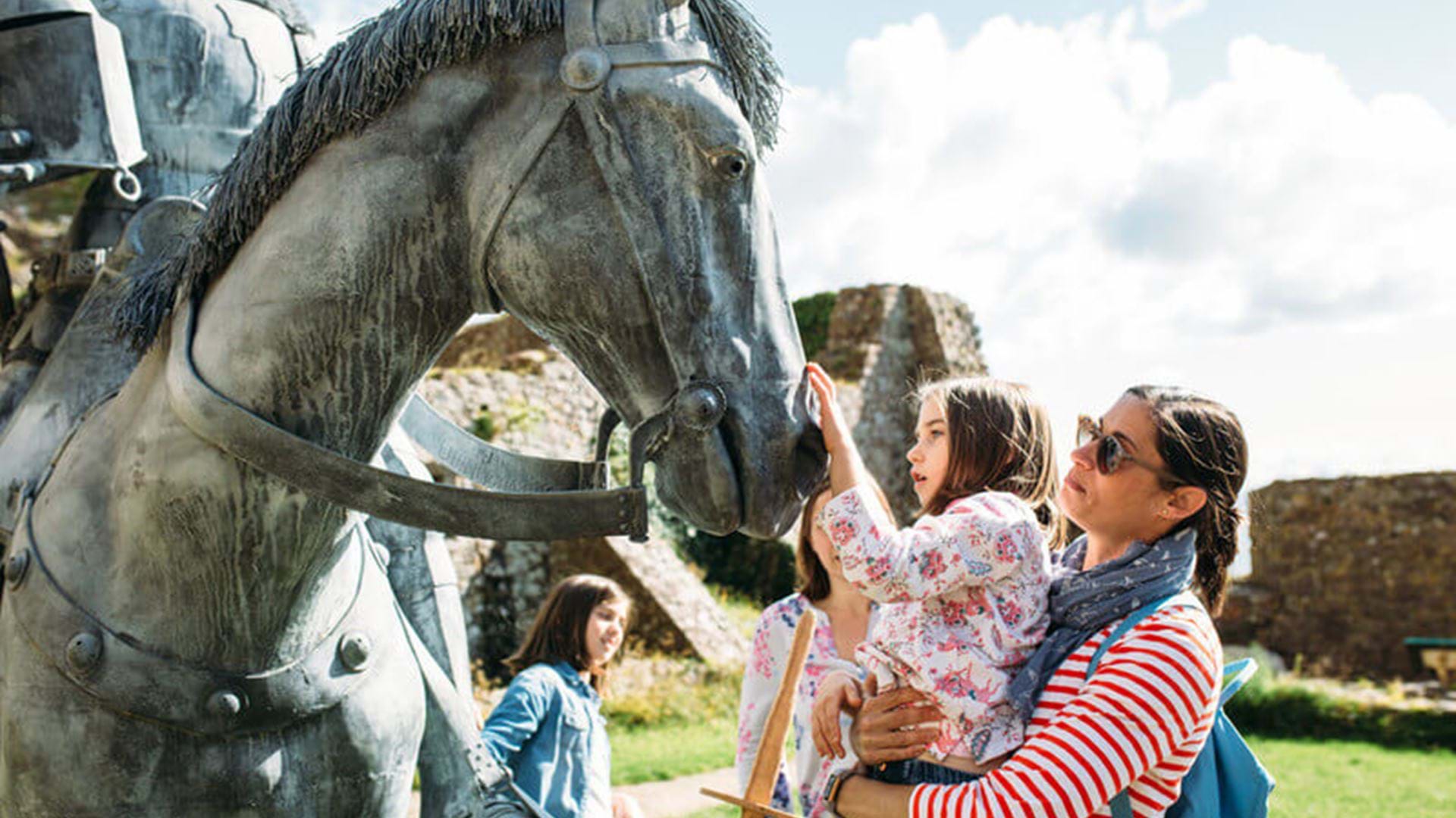children-looking-at-horse-statue-mont-orgueil-jersey-channel-island