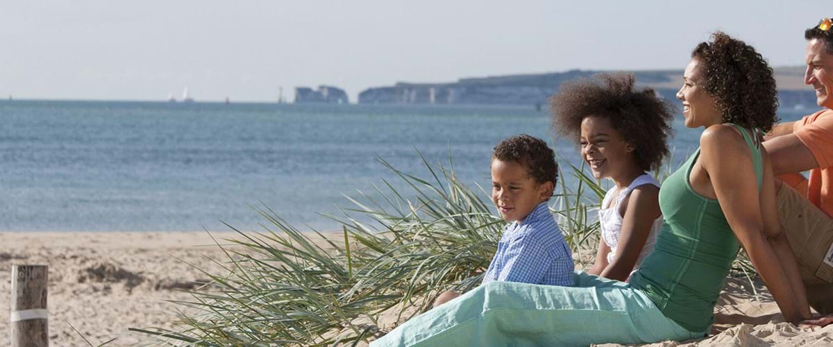 Family enjoying beach at sandbanks